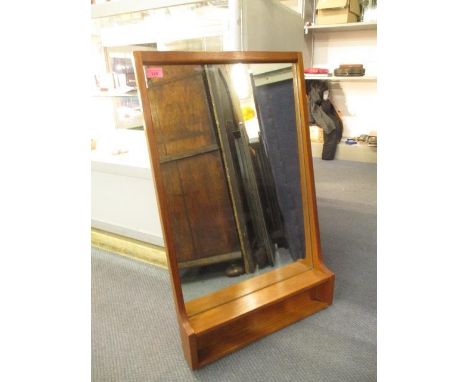 A vintage teak framed wall mirror with a shelf 