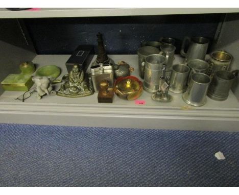 A mixed lot of pewter mugs, an onyx cigarette box, a Cornish serpentine carving of a lighthouse, a brass figural inkwell and 