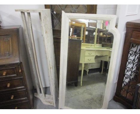 A vintage white Lloyd Loom armchair, a white painted wall mirror, a white painted vintage hanging laundry rack and a white pa