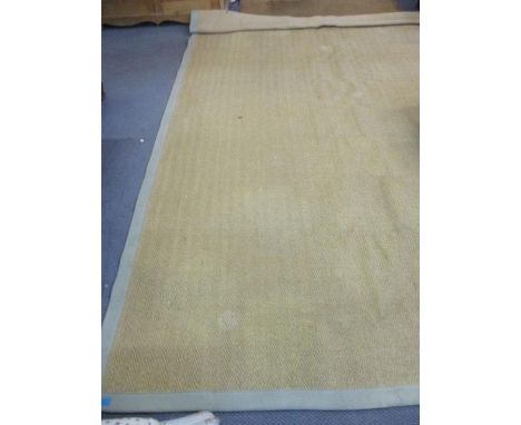 A modern rattan style rug with a pale green banding and a mid 20th century walnut two-tier lamp table on castors 