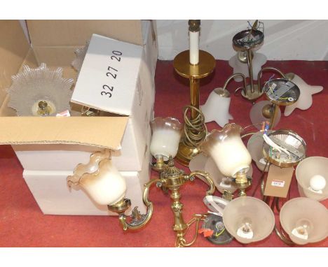 A collection of lacquered brass light fittings to include four ceiling pendants, wall lights, and table lamp