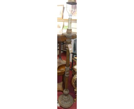 An early 20th century floral carved giltwood standard lamp, in the classical taste, h.144cm (excluding fittings)