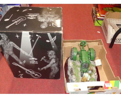 A boxed Leonardo Collection Jail House Rock figurine and a Juliana Collection tractor