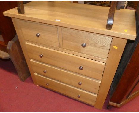 A contemporary blond oak square front chest of two short over three long drawers, width 92cm