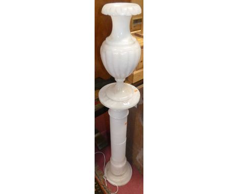 A contemporary turned alabaster pedestal lamp, on conforming pedestal, overall height 134.5cm