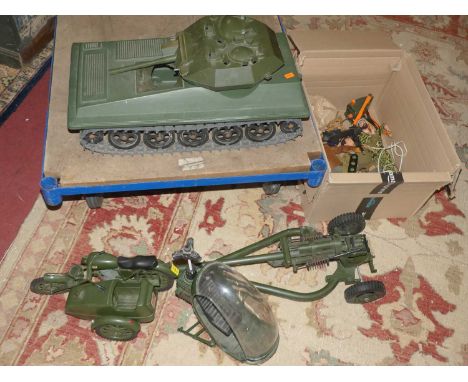 An Action Man tank, helicopter, motorcycle and sidecar, and artillery gun, and a small quantity of accessories and figures