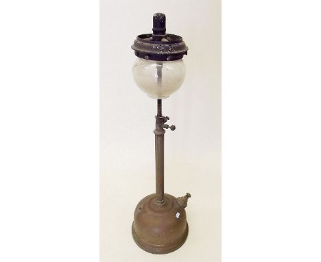 An early 20th century oil lamp with tall column 