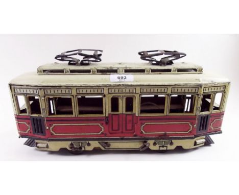 A tinplate clockwork tram - 37cm with electric lighting