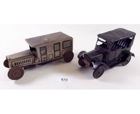 An early tin plate black Ford and a tinplate ambulance with lithograph driver and detailing - repaired 