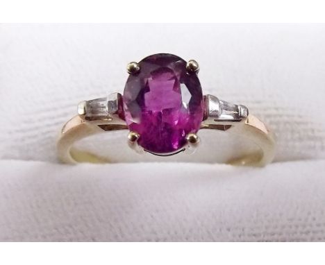 A 9 carat gold ruby and diamond ring