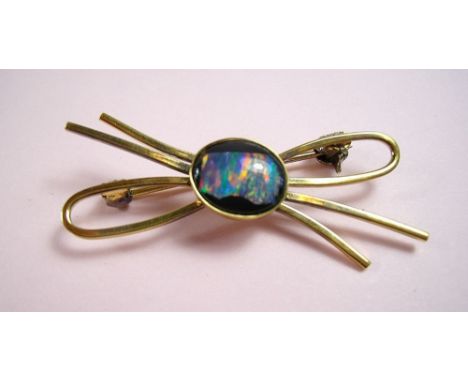 A silver gilt mounted opal brooch 