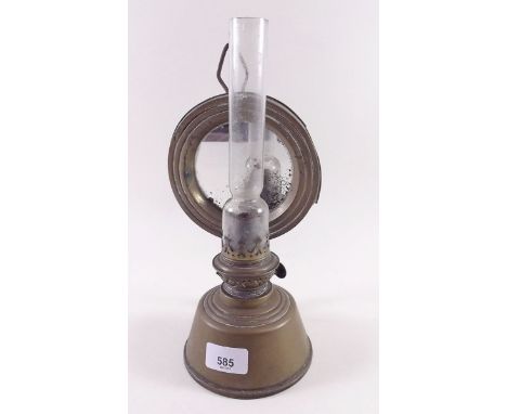 A Victorian brass oil lamp or lace makers lamp with mirror reflector