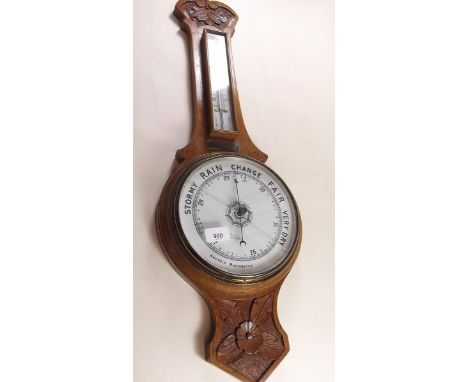 An oak framed barometer/thermometer