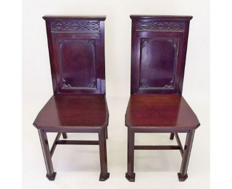 A pair of Victorian mahogany Chippendale style hall chairs