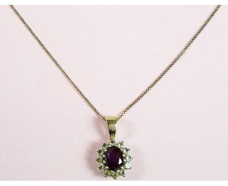 A 9 carat gold amethyst pendant on gold chain 