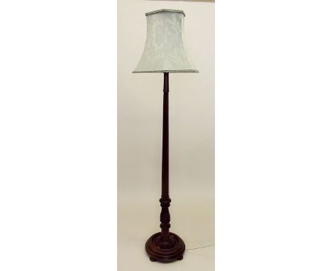 A mahogany octagonal standard lamp 
