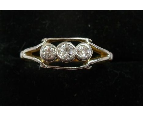An 18 carat gold ring set three diamonds 