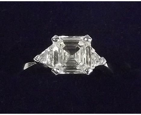 A platinum asscher cut diamond ring (approx 1.35 carats) on trillion cut diamond set shoulders 