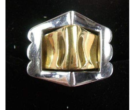 An 18 carat yellow and white gold modern buckle style ring 