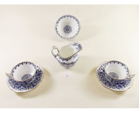 A Coalport blue and white tea service comprising: twelve cups and saucers, twelve tea plates, jug, sugar, and two cake plates