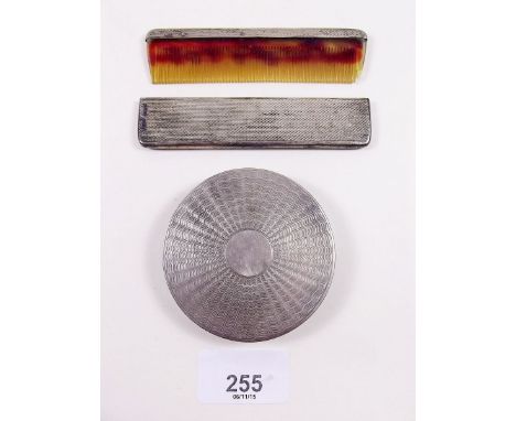 A silver cased handbag comb Birmingham 1947 and a silver compact, Birmingham 1946