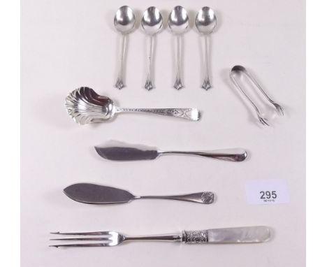 A Georgian silver shell bowl caddy spoon, butter knife, sugar tongs and four coffee spoons, total weight 69g plus a silver pl