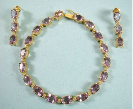 An 18 carat gold amethyst and diamond bracelet and pair of matching earrings, total 22g