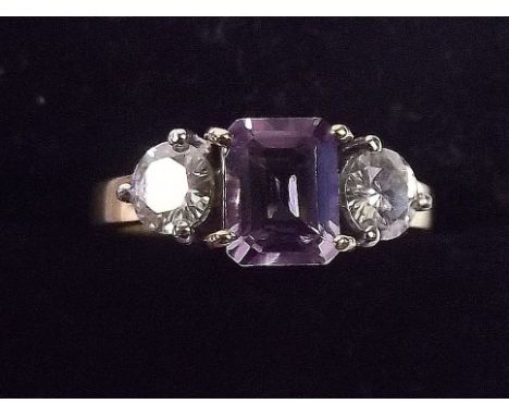An 18 carat gold amethyst and moissanite set ring 