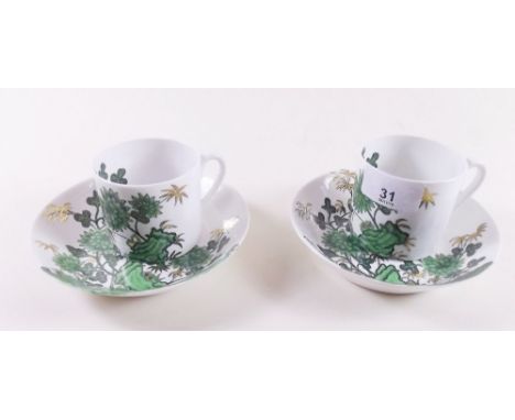 A Spode set of five coffee cups and saucers decorated green chinoiserie decoration