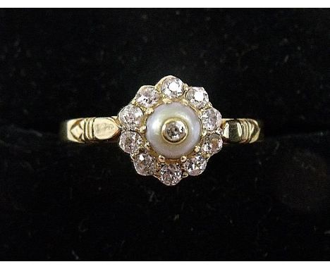 An 18 carat gold Edwardian diamond and pearl cluster ring 