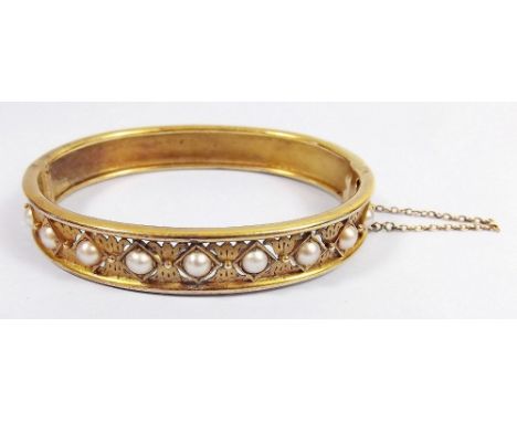 A Victorian gold hinged bangle set pearls 