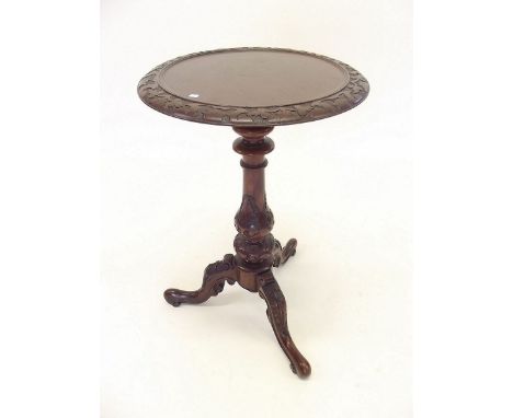 A Victorian mahogany occasional table with carved border and column all on tripod base