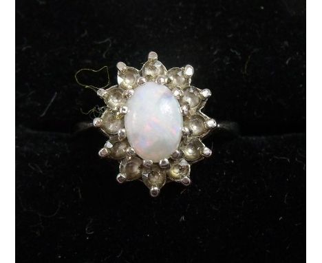 A silver and opal ring