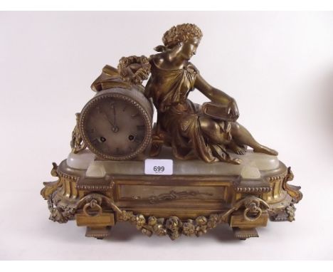 A French gilt metal and marble mantel clock with recumbent woman - 30cm high 