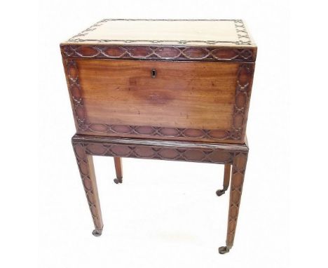 A 19th century mahogany Chippendale style small cellarette on stand with blind fretwork decoration