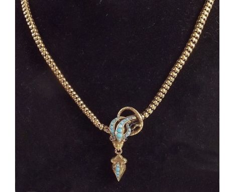 A Victorian gold necklace with turquoise set snakeshead ruby eyes - 20g, one link a/f
