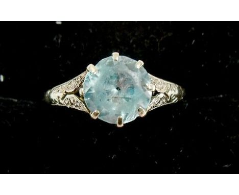 A 9 carat white gold ring set blue zircon 