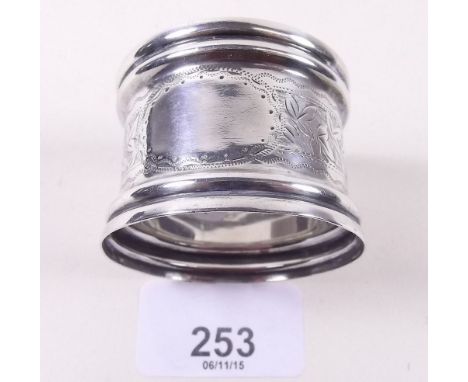 An engraved silver napkin ring 