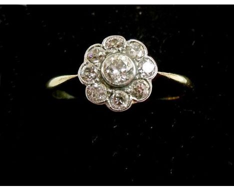 An 18 carat gold Edwardian diamond cluster ring 