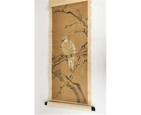 A Chinese hanging scroll, ink on paper laid on silk, depicting a cockatoo on a blooming prunus branch, with single red seal b