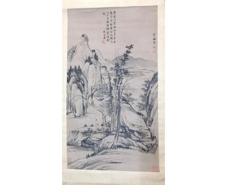 A Chinese Ming style hanging scroll painting, ink on paper laid on silk, depicting a mountainous river landscape with a figur
