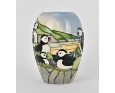 A Moorcroft ceramic baluster vase in the 'Puffin' pattern designed by Carol Lovett, 1997, with impressed marks and signatures