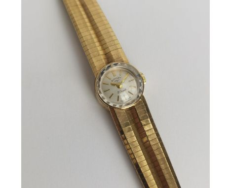 A vintage ladies 9ct gold cased manual wind Rotary wristwatch having a silvered dial with applied yellow metal baton hour mar