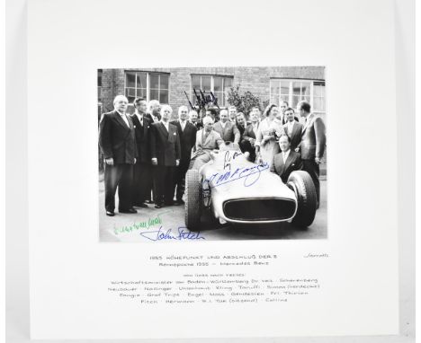 A signed reprinted group portrait photograph at the of the 1955 season at Mercedes Benz, signed by Stirling Moss, John Fitch,