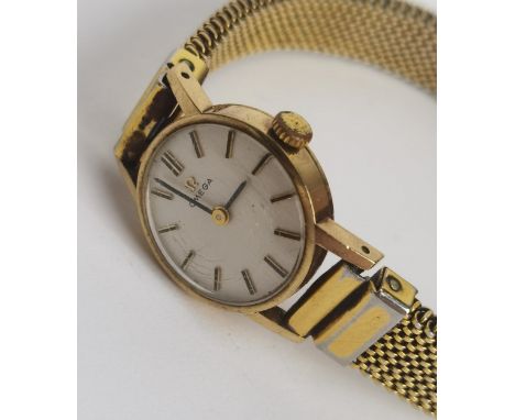 A ladies circa 1974 9ct gold manual wind Omega having a silvered dial with baton hour markers, the 625 Cal. movement signed O