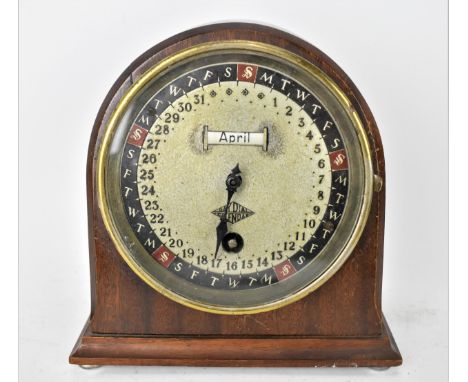 An early 20th century Day Dial Calendar clock in a mahogany case, the circular dial having a month aperture, outer ring showi
