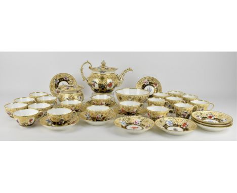 A large early Victorian Coalport tea service to include a teapot, a lidded sugar pot, a slop bowl, twelve tea cups, twelve sa