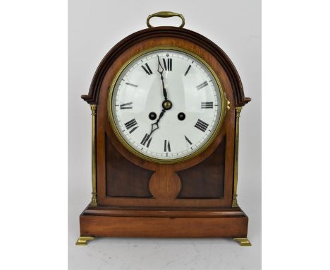 A late 19th century 8 day mantle clock, the mahogany arched top case having brass handle, columns and feet and dial with Roma