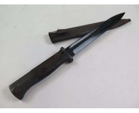 Bayonet: German 3rd Reich Model 1884/98 knife bayonet by Carl Eickhorn Seabbard marked 'MUNDLOS'. Wood grips (some wear) stee