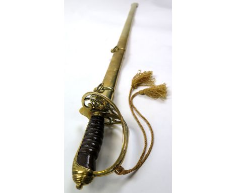 Sword: An 1854 Pattern Infantry Officers Sword. Blade 32.5" with V.R. Cypher. Gothic brass hilt V.R. Wirebound leather grip (